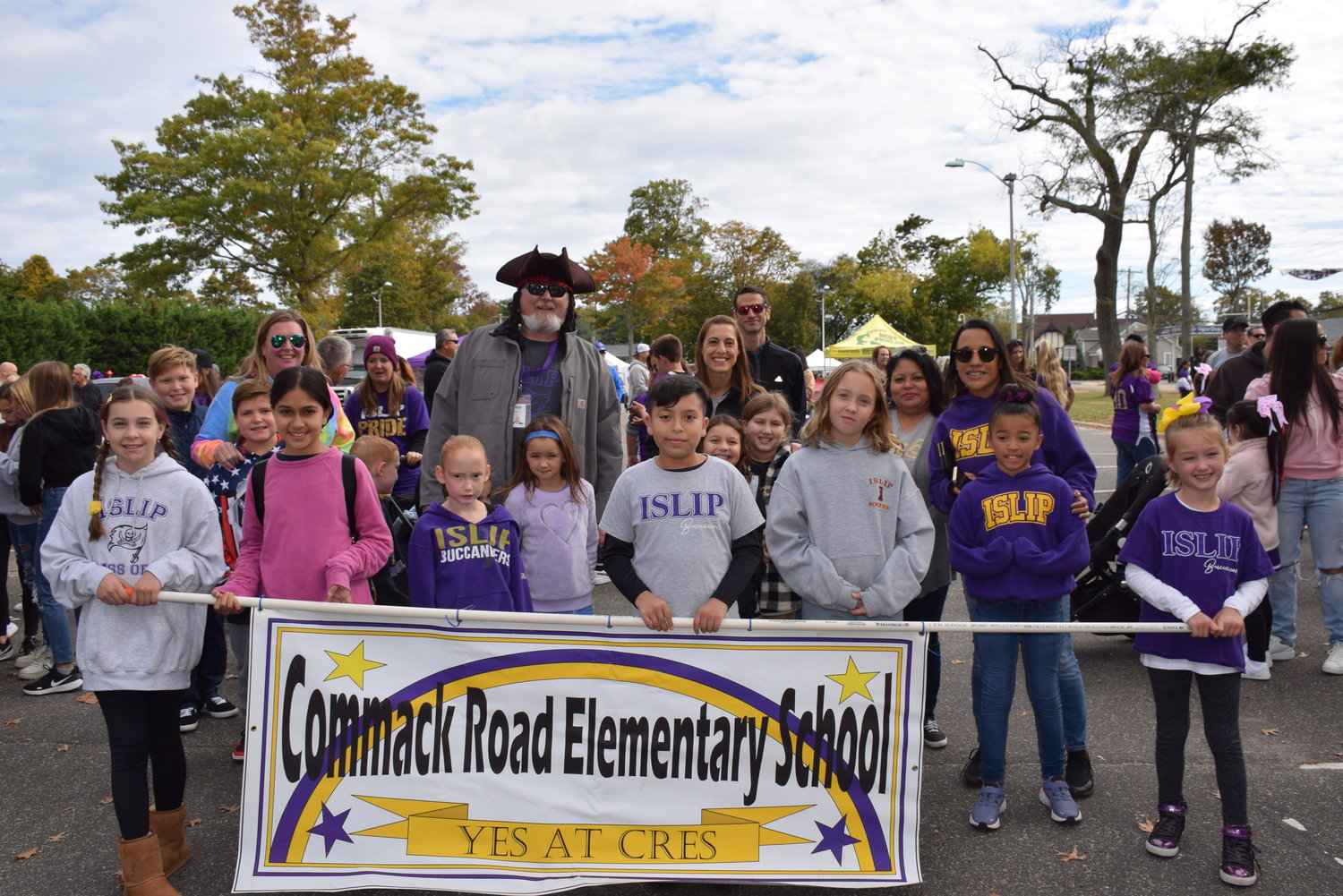 Commack Road Elementary School Principal James Cameron and students gathered at Town Hall prior to the homecoming parade to set up for their march down Main Street in Islip.